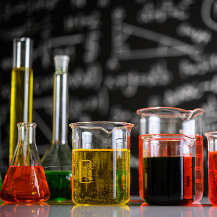 Laboratory glassware with liquids of different color.